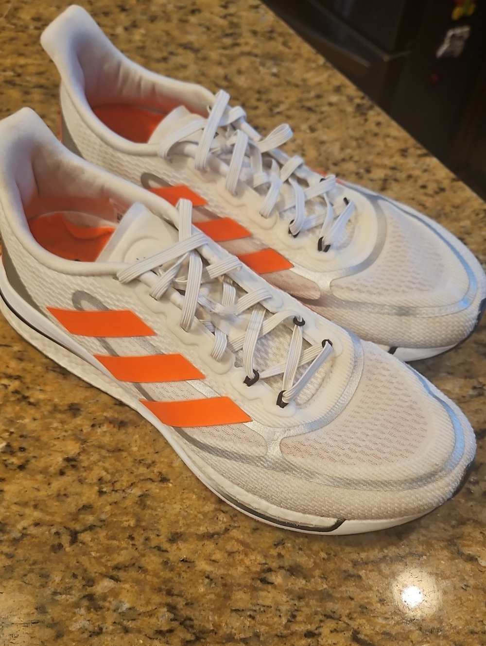 Adidas Men's White Running Shoes with Orange Stripes Supernov